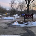 Entrance Sign dusk with candles